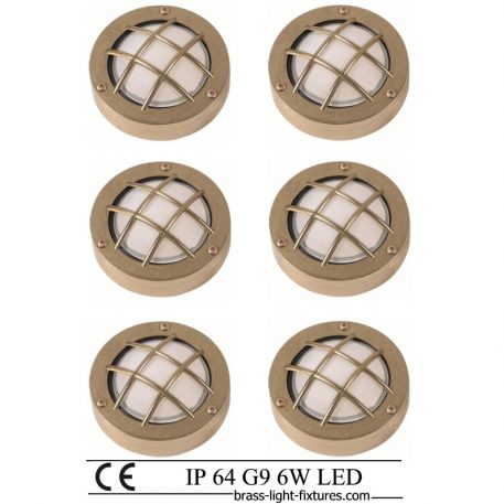 Moisture proof wall lights. Set of six decorative wall lights made of brass with a safety cage